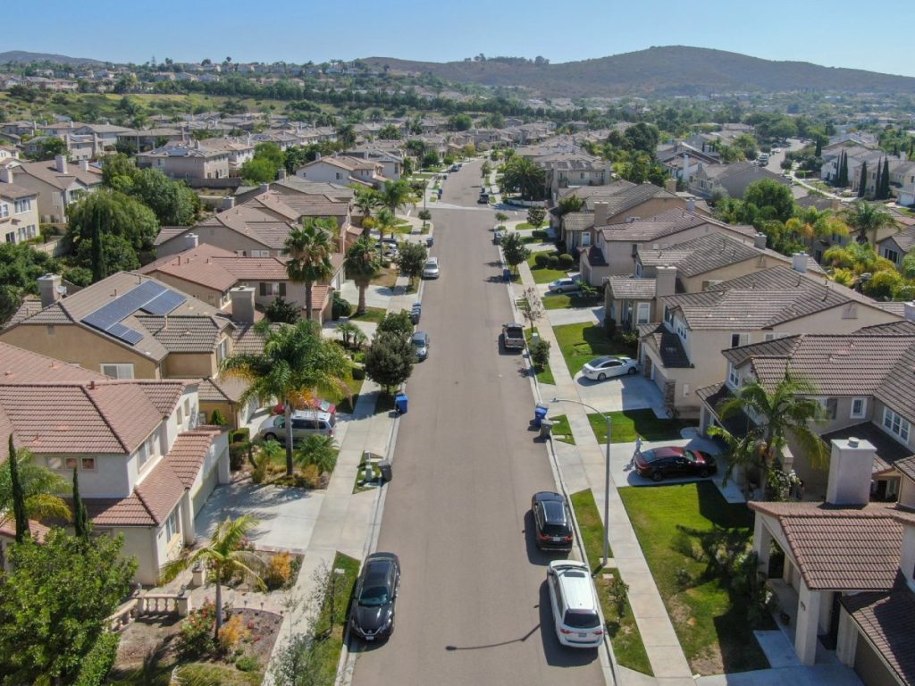 Aerial view of a suburban California neighborhood with single-family homes, representing communities impacted by the California home insurance crisis.