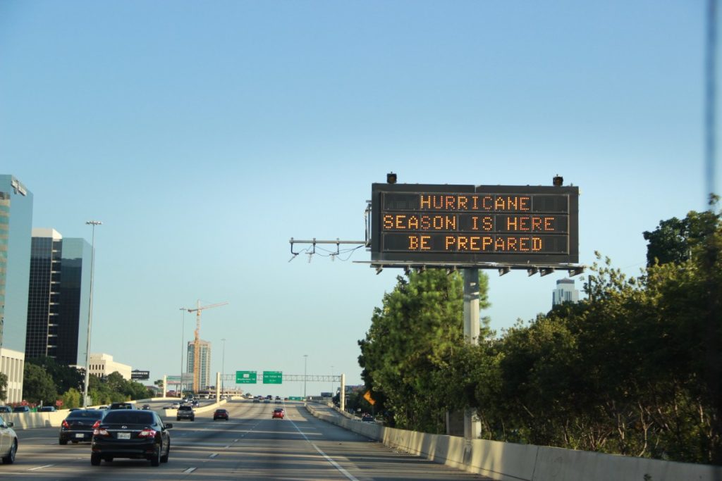 A digital highway sign in Texas warns drivers with the message “Hurricane Season Is Here, Be Prepared,” reminding residents about the importance of readiness and hurricane insurance in Texas.